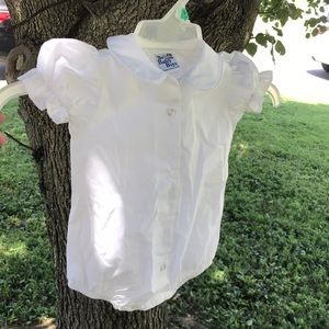 White Peter Pan collared button up baby jumper.